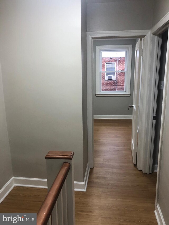 hall with dark hardwood / wood-style floors