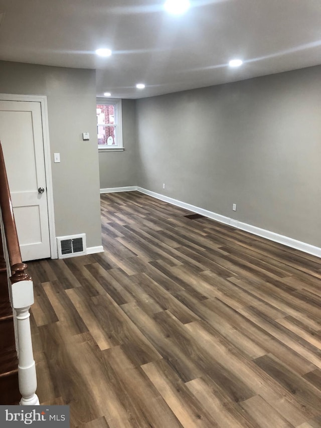 basement featuring dark wood-type flooring