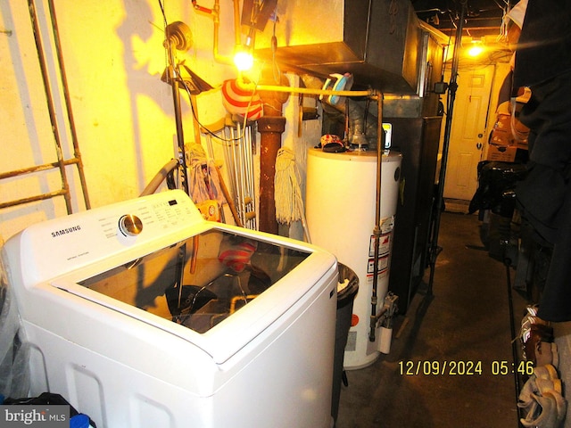 washroom featuring washer / dryer and gas water heater