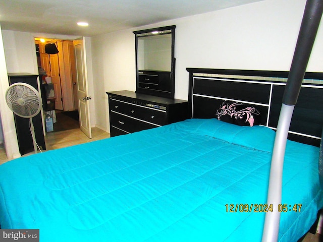 bedroom with wood-type flooring