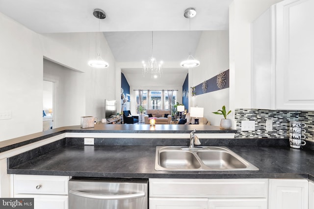 kitchen with backsplash, sink, dishwasher, white cabinetry, and hanging light fixtures