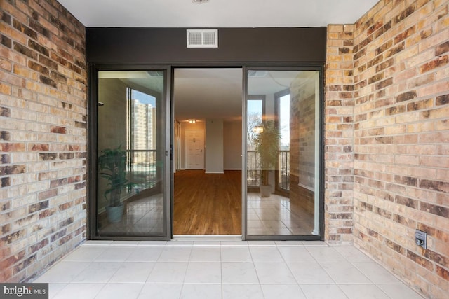 doorway to property featuring visible vents