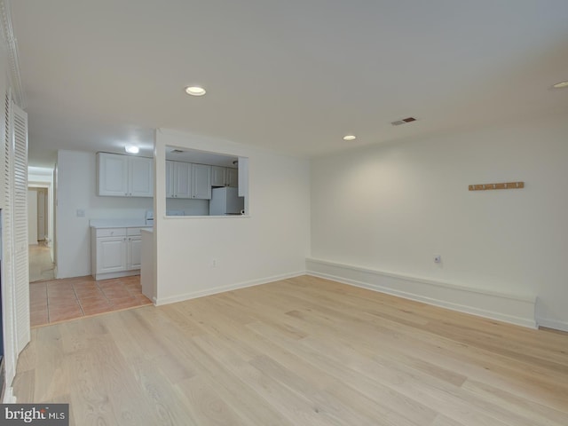 unfurnished room featuring light wood-type flooring