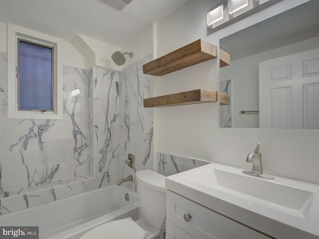 full bathroom featuring toilet, vanity, and tiled shower / bath