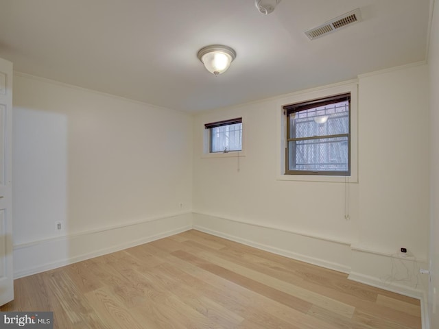 spare room featuring light hardwood / wood-style flooring