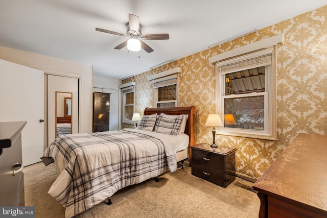 carpeted bedroom featuring ceiling fan