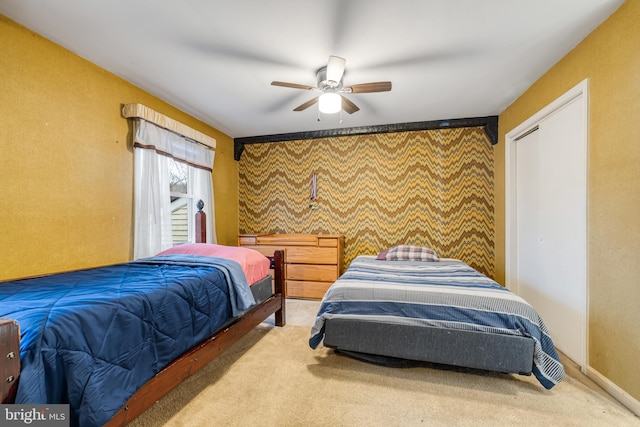 bedroom with ceiling fan and carpet floors