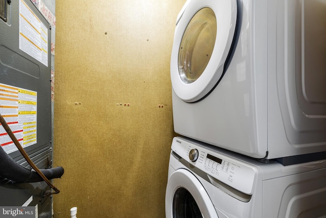 laundry room featuring stacked washing maching and dryer