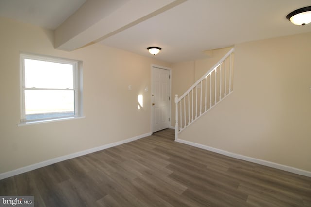 entryway featuring beamed ceiling and dark hardwood / wood-style floors