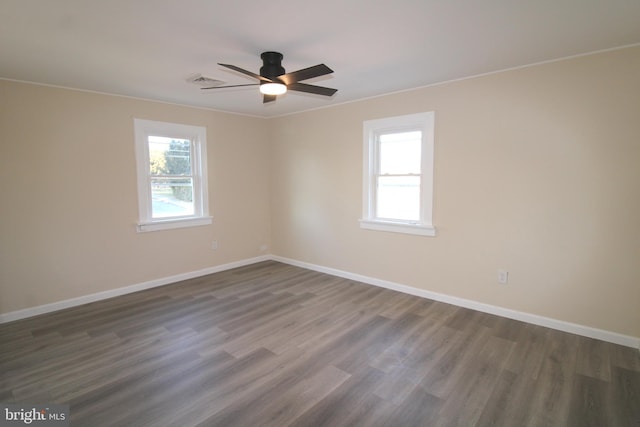 unfurnished room with dark hardwood / wood-style floors and ceiling fan