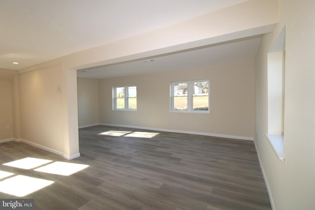 unfurnished room featuring dark hardwood / wood-style floors