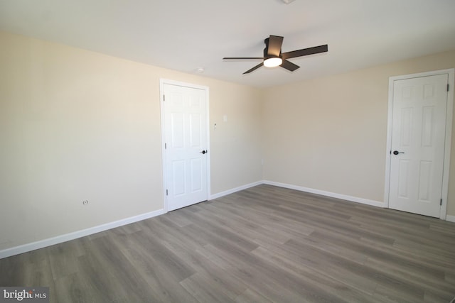 unfurnished room with hardwood / wood-style flooring and ceiling fan