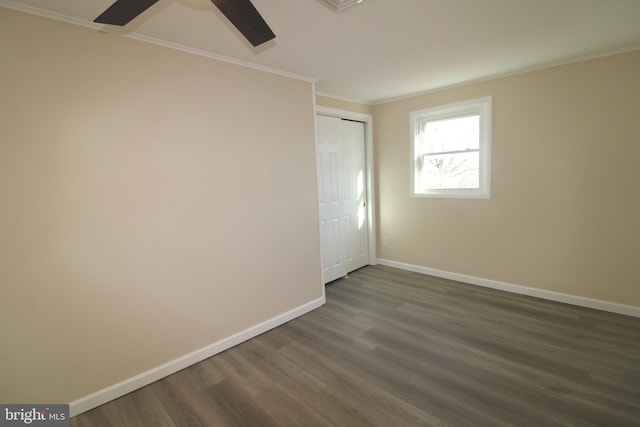 unfurnished room with dark hardwood / wood-style floors, ceiling fan, and ornamental molding