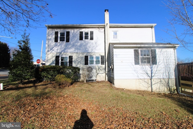 back of house with a yard