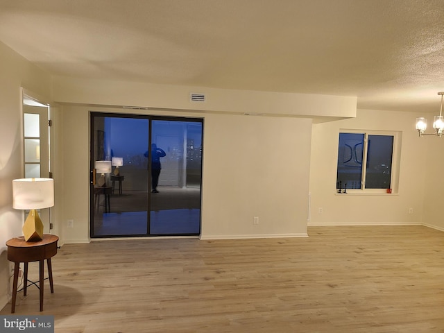 8340 Greensboro Dr Unit 1010, Mclean, VA 22102 - spare room with wood finished floors and a chandelier