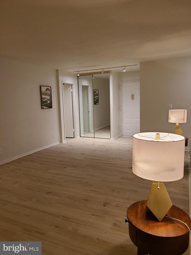 hallway featuring wood-type flooring