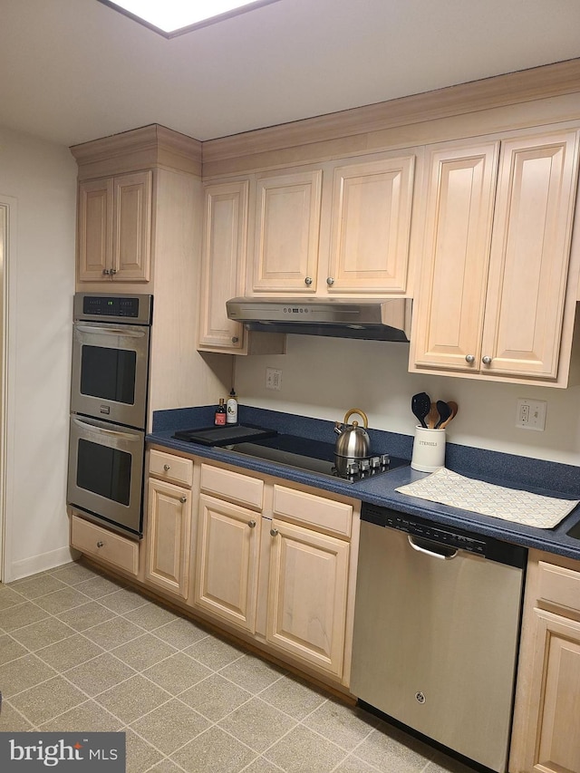 kitchen with light brown cabinets and stainless steel appliances