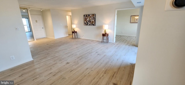 unfurnished living room with light wood-type flooring