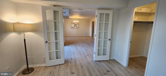 8340 Greensboro Dr Unit 1010, Mclean, VA 22102 - hall featuring wood finished floors, french doors, and a chandelier