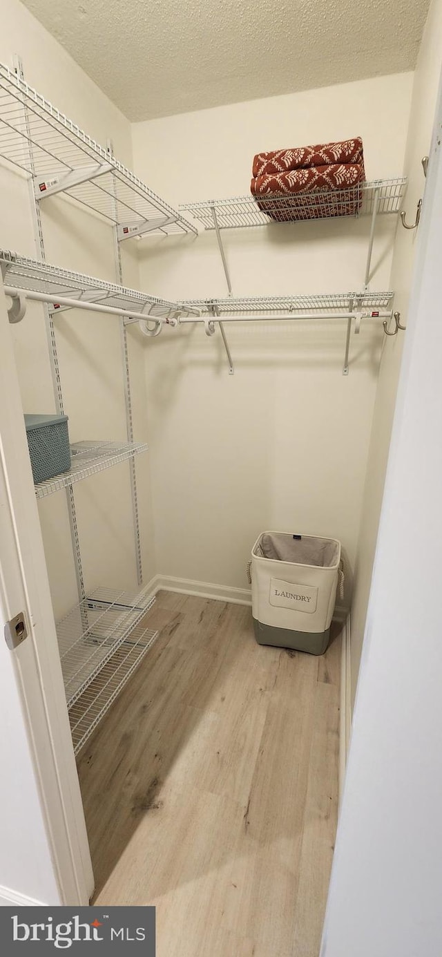 8340 Greensboro Dr Unit 1010, Mclean, VA 22102 - spacious closet featuring wood finished floors