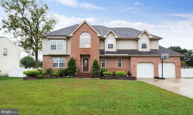 front of property with a garage and a front lawn