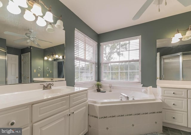 bathroom with vanity, ceiling fan, tile patterned flooring, and plus walk in shower