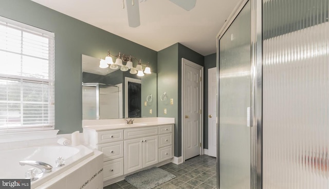 bathroom featuring tile patterned flooring, shower with separate bathtub, vanity, and ceiling fan