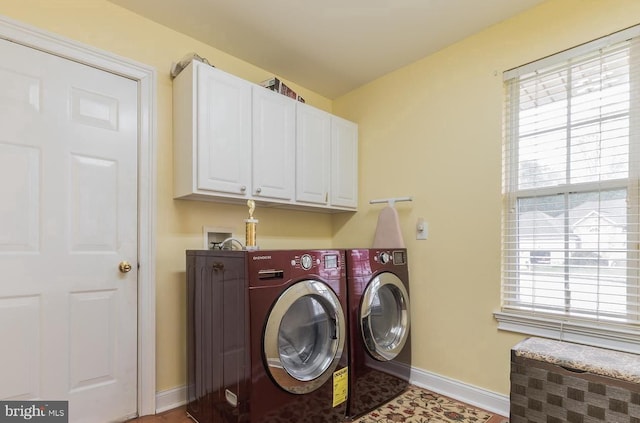 laundry area with cabinets and independent washer and dryer