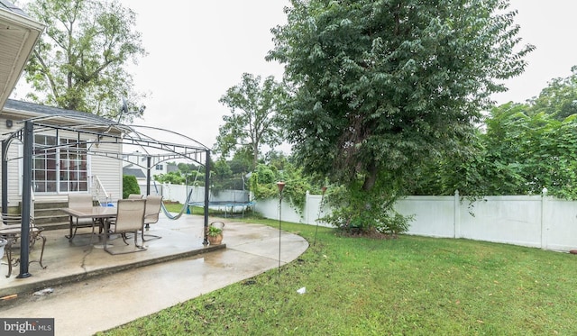 view of yard featuring a gazebo, a patio area, and a trampoline