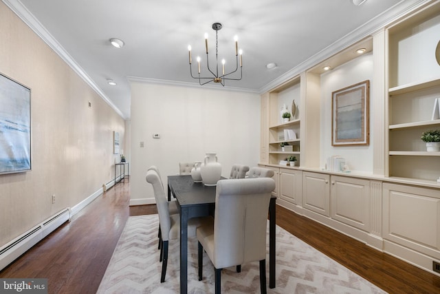 dining room featuring light hardwood / wood-style floors, a baseboard radiator, an inviting chandelier, ornamental molding, and built in features