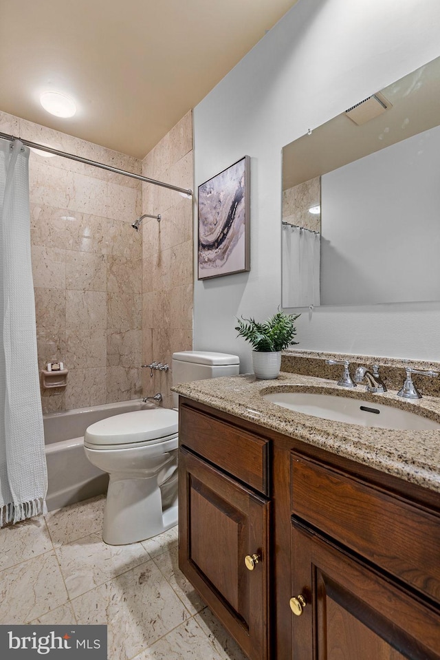 full bathroom featuring toilet, vanity, and shower / bath combo