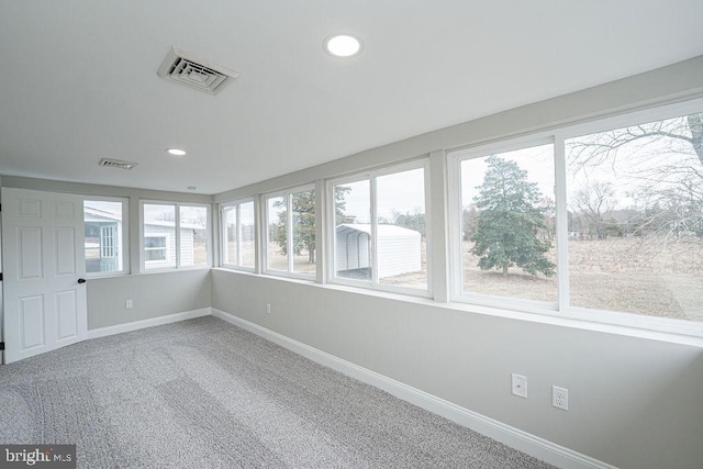 unfurnished sunroom with plenty of natural light