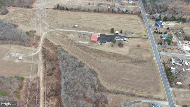 birds eye view of property featuring a rural view