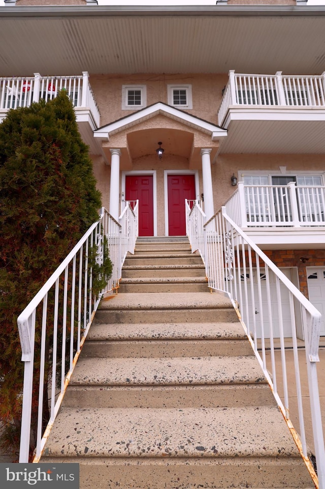 view of exterior entry with a porch