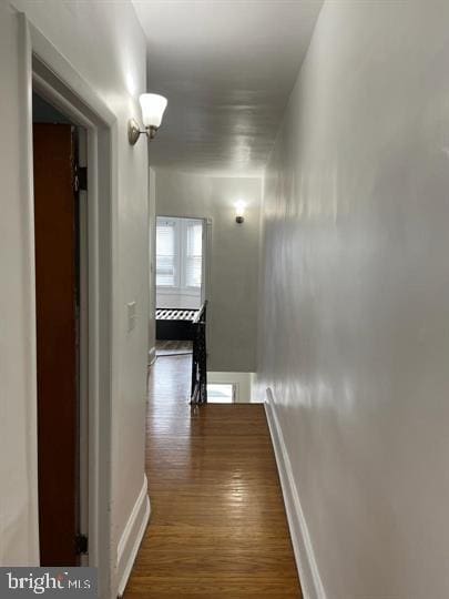 hallway featuring dark hardwood / wood-style flooring