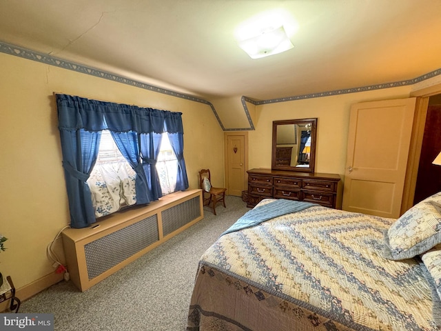 bedroom with carpet and radiator