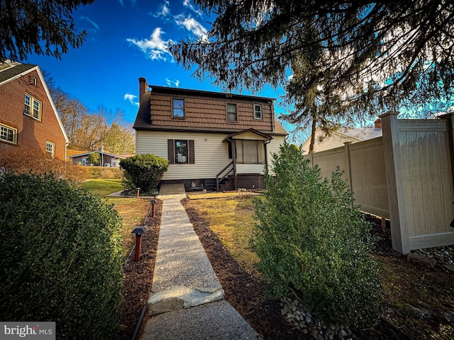 back of house featuring a yard