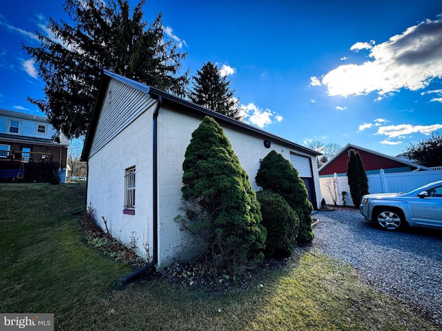 view of home's exterior with a lawn