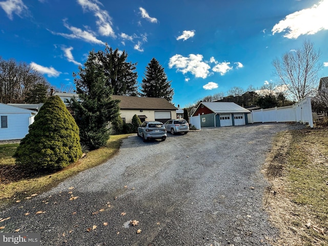 view of front facade featuring an outbuilding and a garage