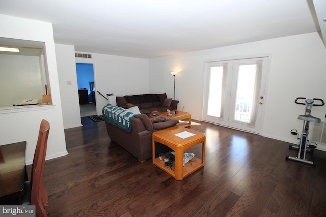 living room featuring dark wood-type flooring