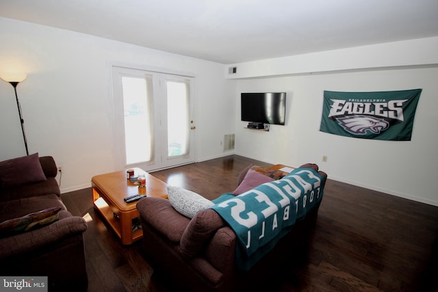 living room with dark wood-type flooring