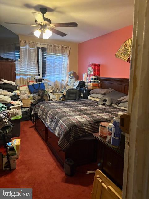 carpeted bedroom with ceiling fan