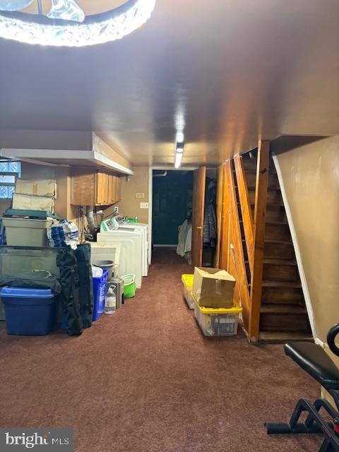 interior space with dark colored carpet and independent washer and dryer