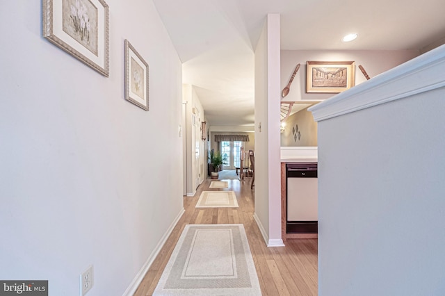 corridor with light wood-type flooring