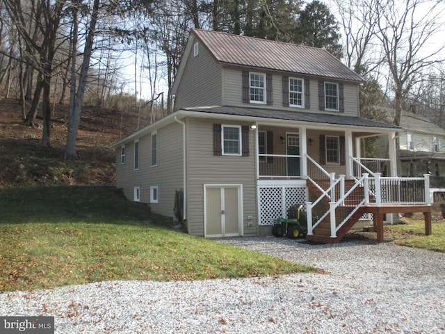 view of front of home featuring a front lawn and a porch