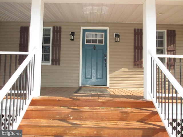 doorway to property with a porch