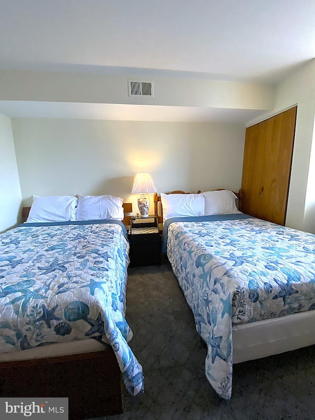 carpeted bedroom with visible vents