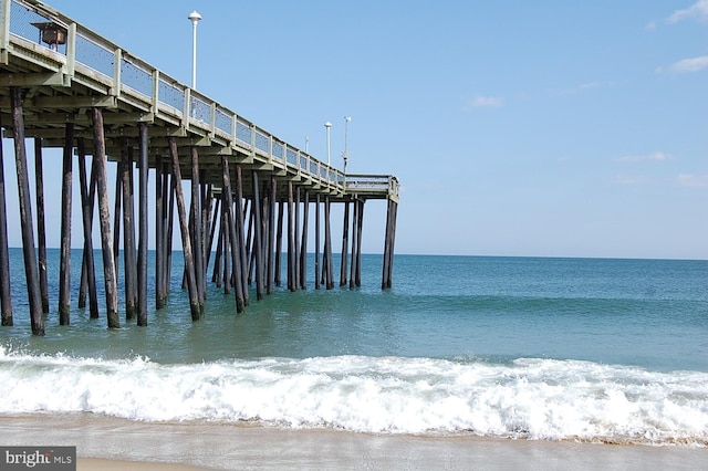 view of dock featuring a pier and a water view