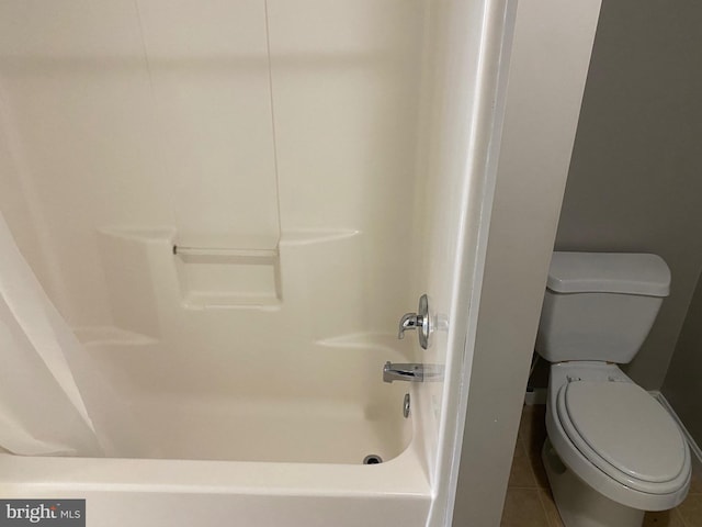 bathroom with tile patterned flooring and toilet