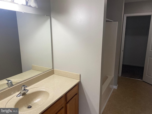 bathroom with tile patterned floors and vanity